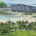 an aerial view of a beach with a large building in the background